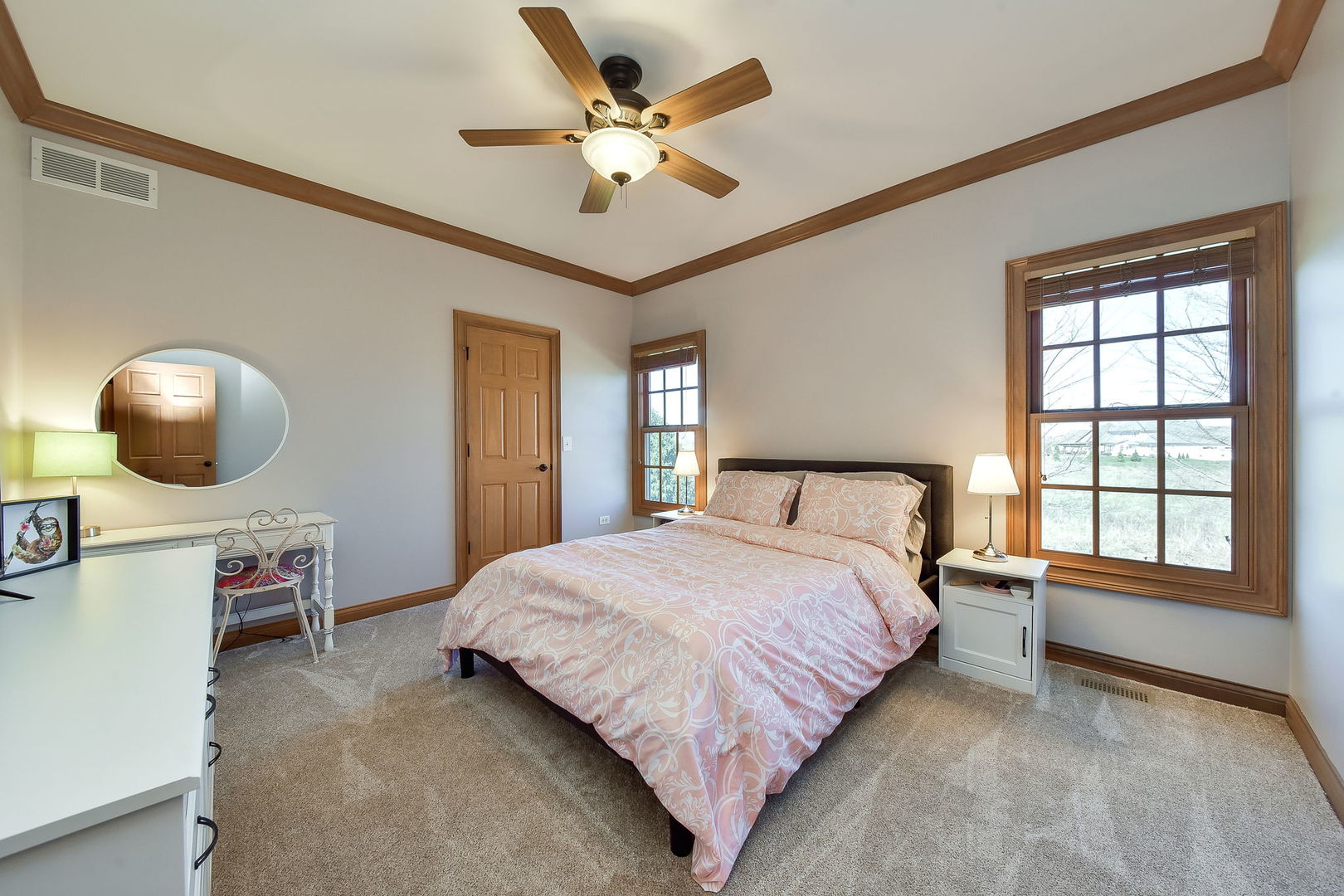 1737 Hunters Ridge Lane Sugar Grove, IL 60554 - Photo 24 of 50 a bedroom with a large bed and a chandelier
