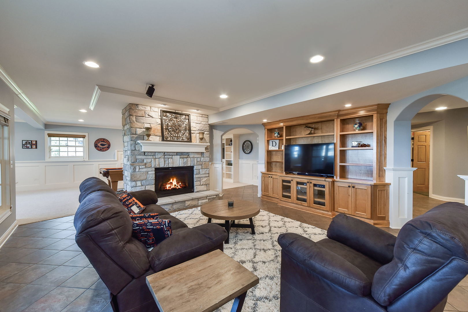 1737 Hunters Ridge Lane Sugar Grove, IL 60554 - Photo 27 of 50 a living room with furniture a flat screen tv and a fireplace