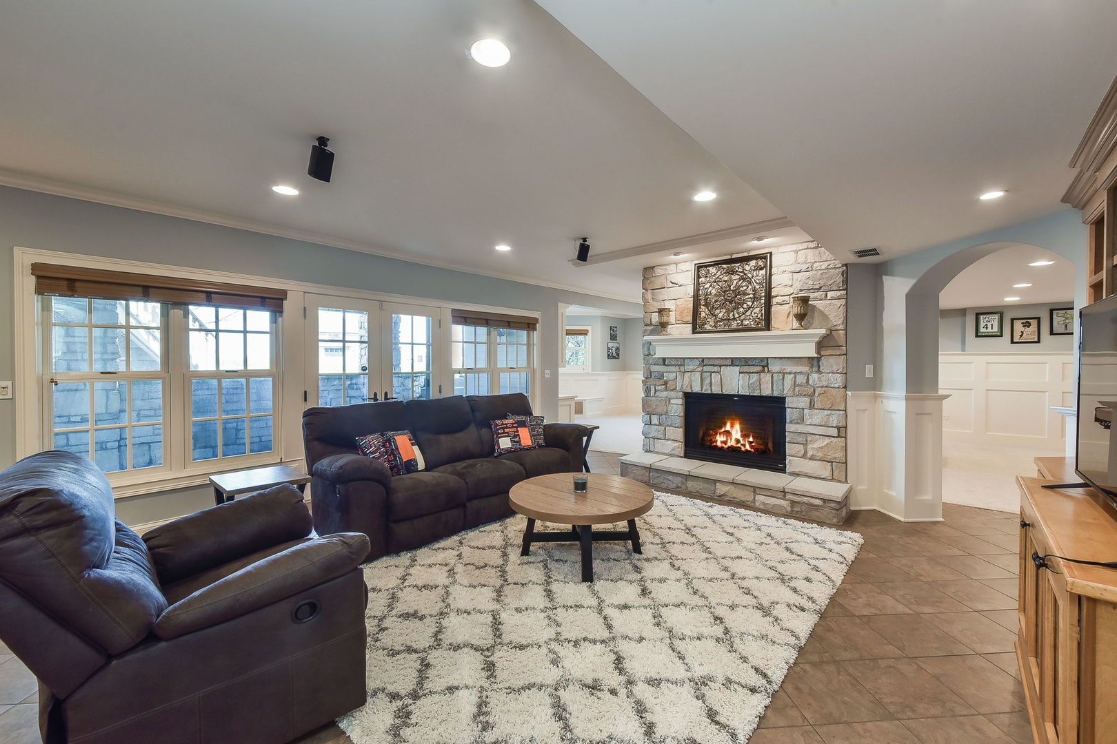1737 Hunters Ridge Lane Sugar Grove, IL 60554 - Photo 28 of 50 a living room with furniture a large window and a fireplace