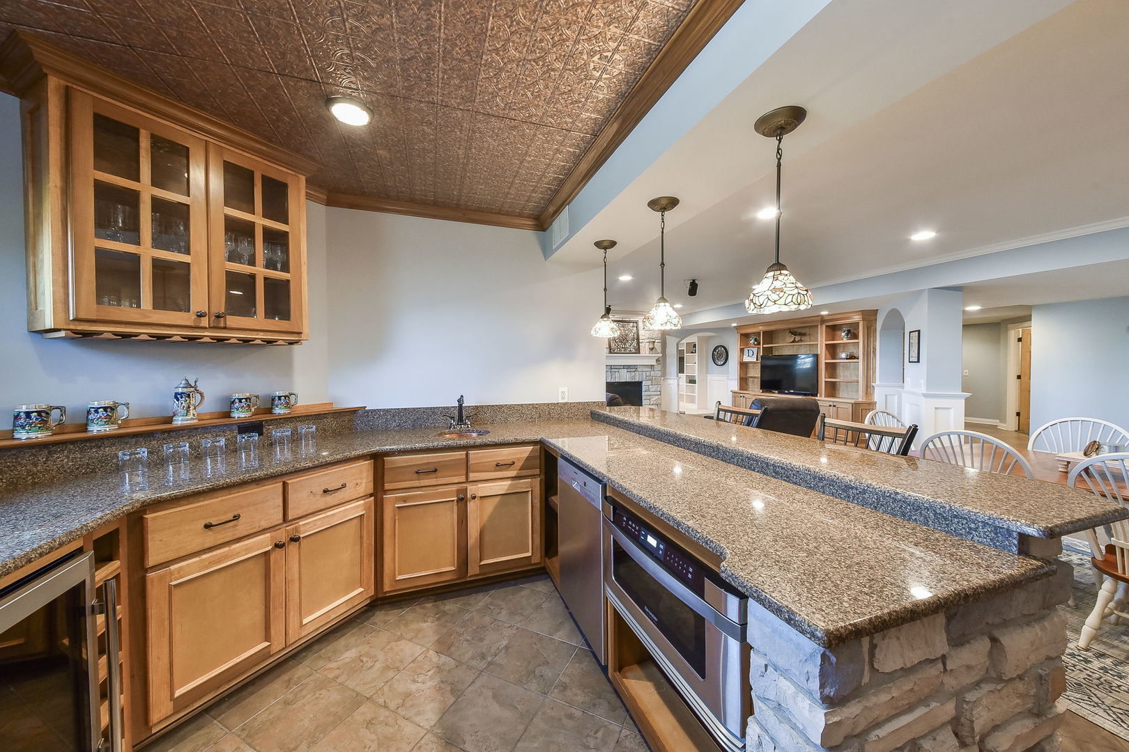 1737 Hunters Ridge Lane Sugar Grove, IL 60554 - Photo 32 of 50 a large kitchen with kitchen island a large counter space a sink stainless steel appliances and cabinets
