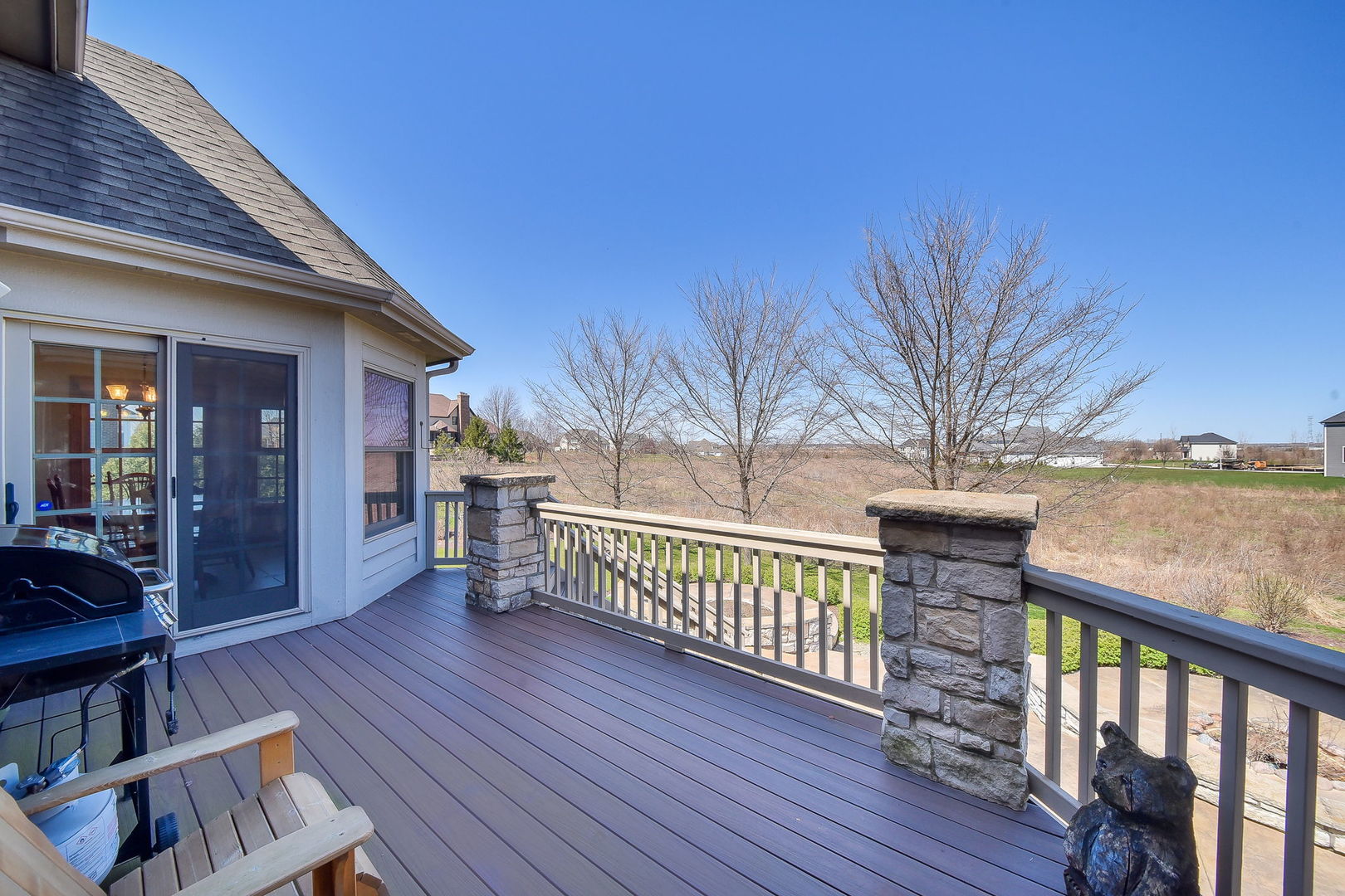 1737 Hunters Ridge Lane Sugar Grove, IL 60554 - Photo 43 of 50 a view of a balcony with wooden floor and outdoor seating