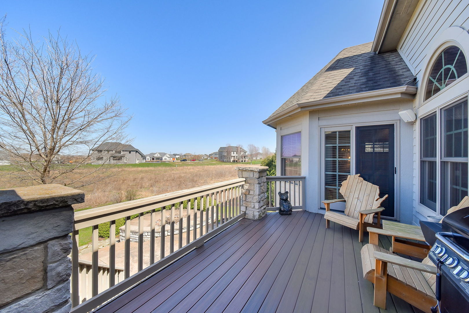 1737 Hunters Ridge Lane Sugar Grove, IL 60554 - Photo 44 of 50 a view of a balcony with chair and wooden floor