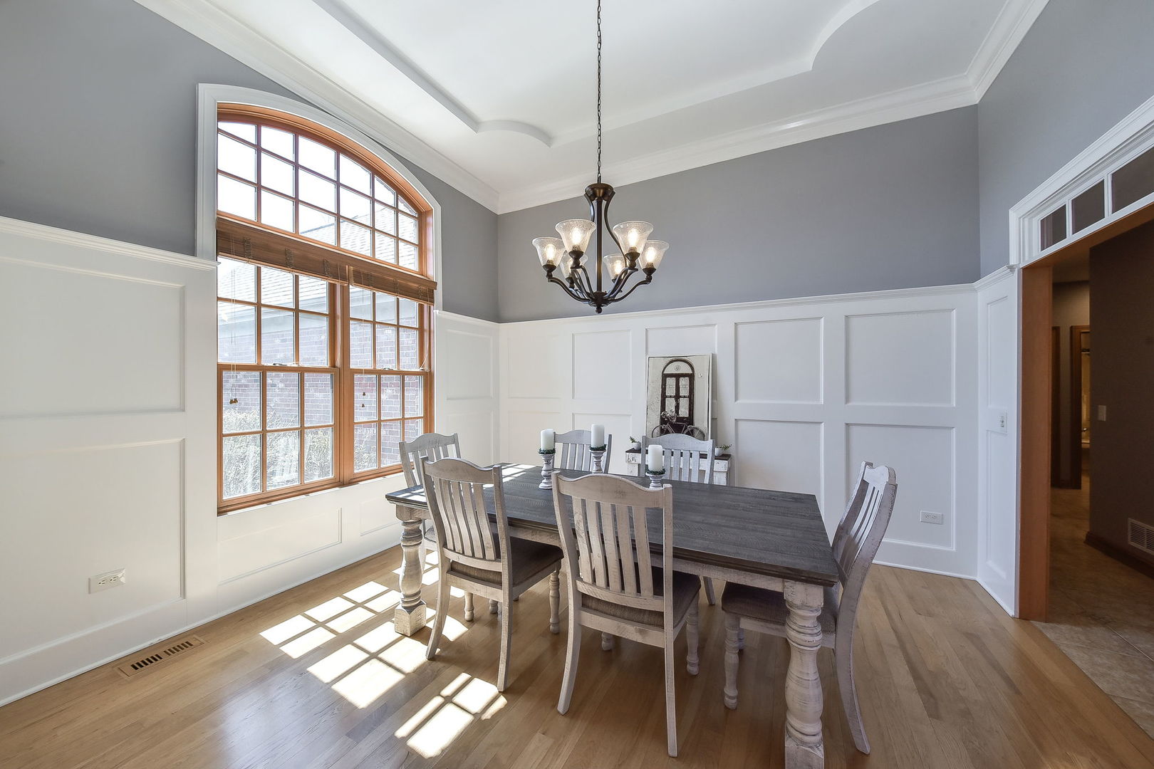 1737 Hunters Ridge Lane Sugar Grove, IL 60554 - Photo 7 of 50 a view of a dining room with furniture a chandelier and wooden floor