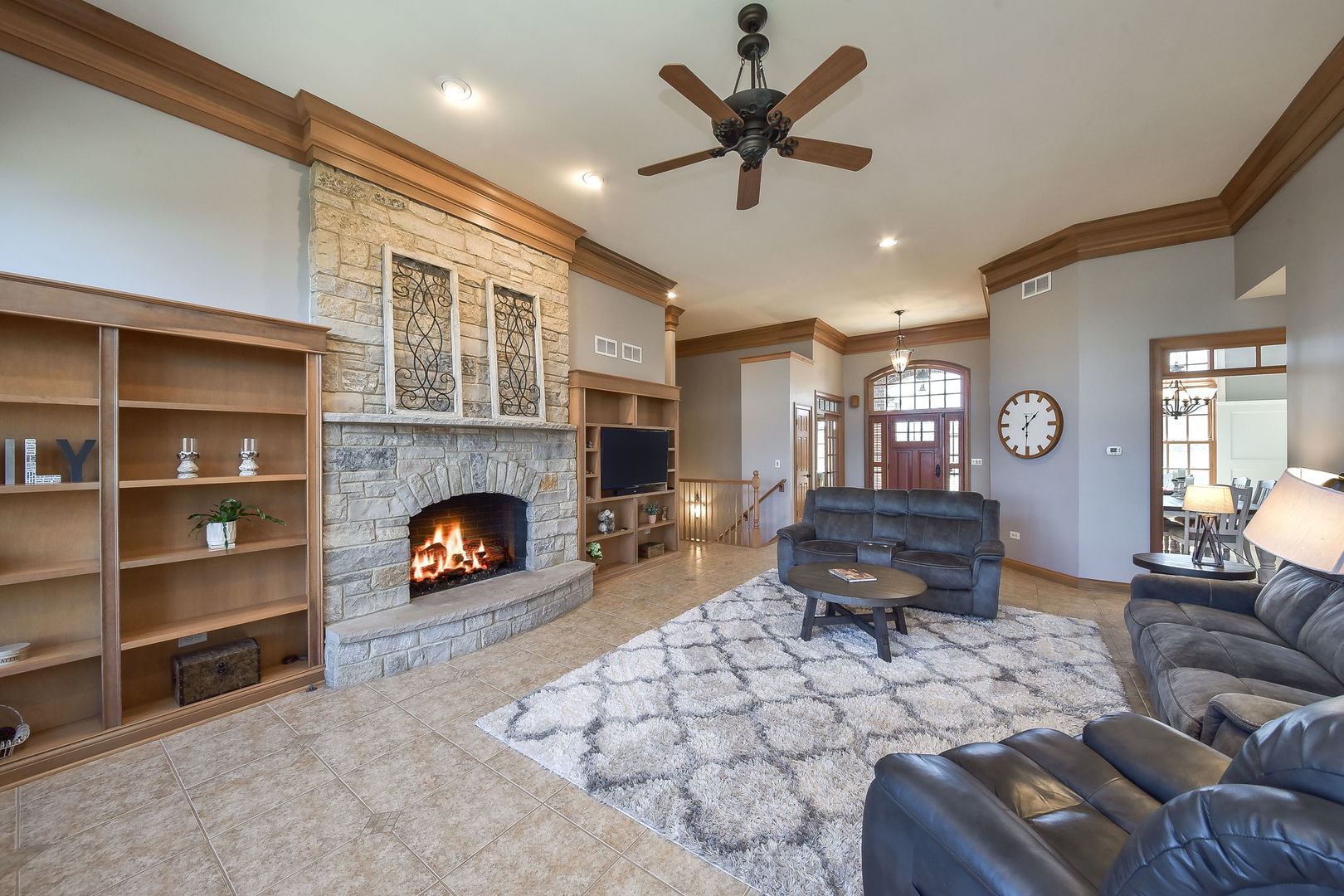 1737 Hunters Ridge Lane Sugar Grove, IL 60554 - Photo 8 of 50 a living room with furniture and a fireplace