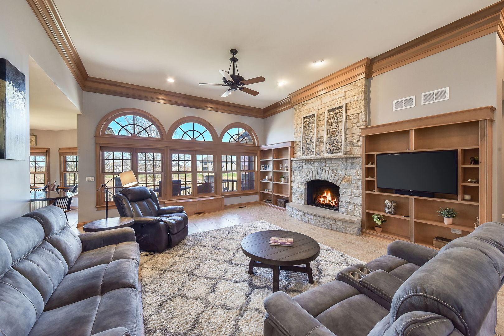 1737 Hunters Ridge Lane Sugar Grove, IL 60554 - Photo 10 of 50 a living room with furniture a fireplace and a flat screen tv