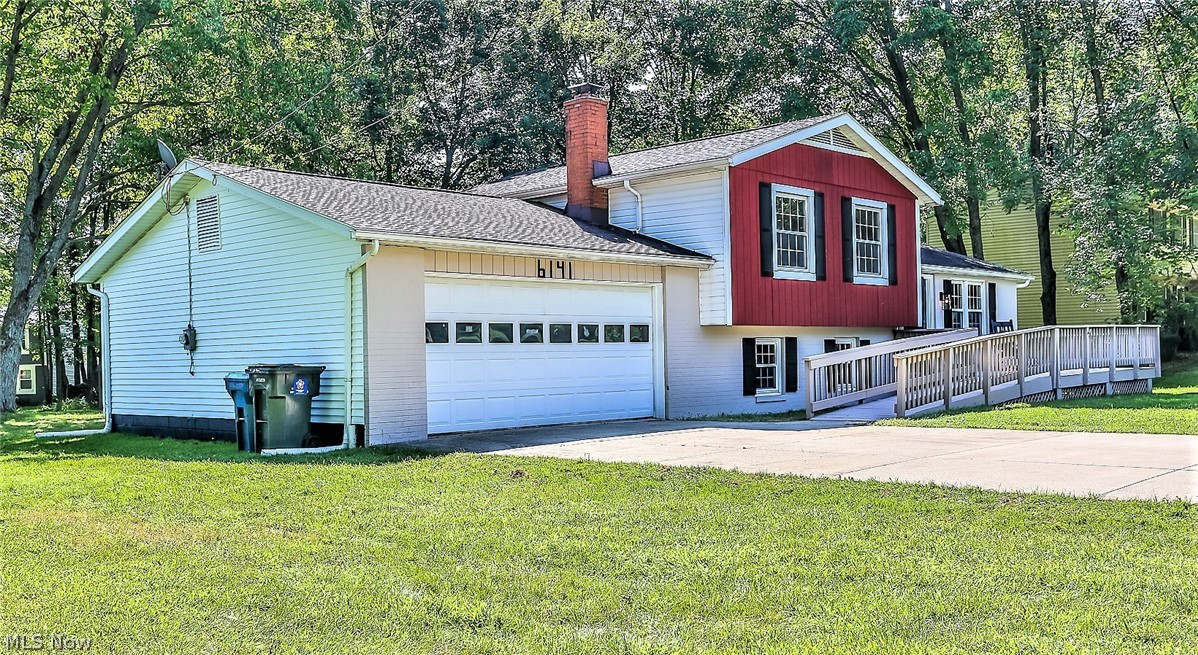 6141 Kungle Road New Franklin, OH 44216 - Photo 28 of 31 *ATTACHED 2 CAR GARAGE, WIDE CONCRETE DRIVEWAY, WALKWAY, CUSTOM SHUTTERS AND MORE! ~