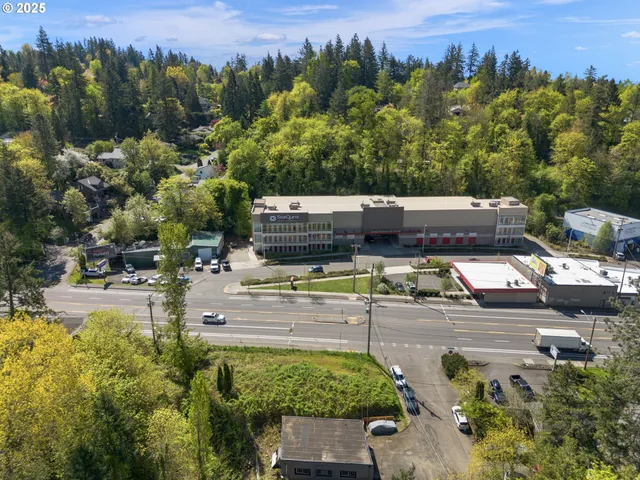 a view of a swimming pool with a patio and a garden