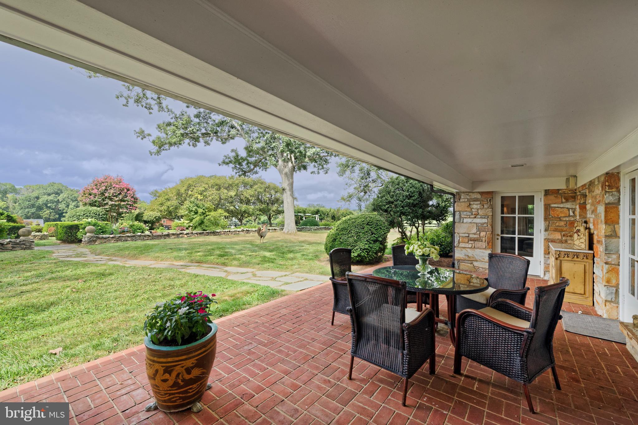 35771 Snake Hill Road Middleburg, VA 20117 - Photo 30 of 74 Large covered brick terrace looks over gardens
