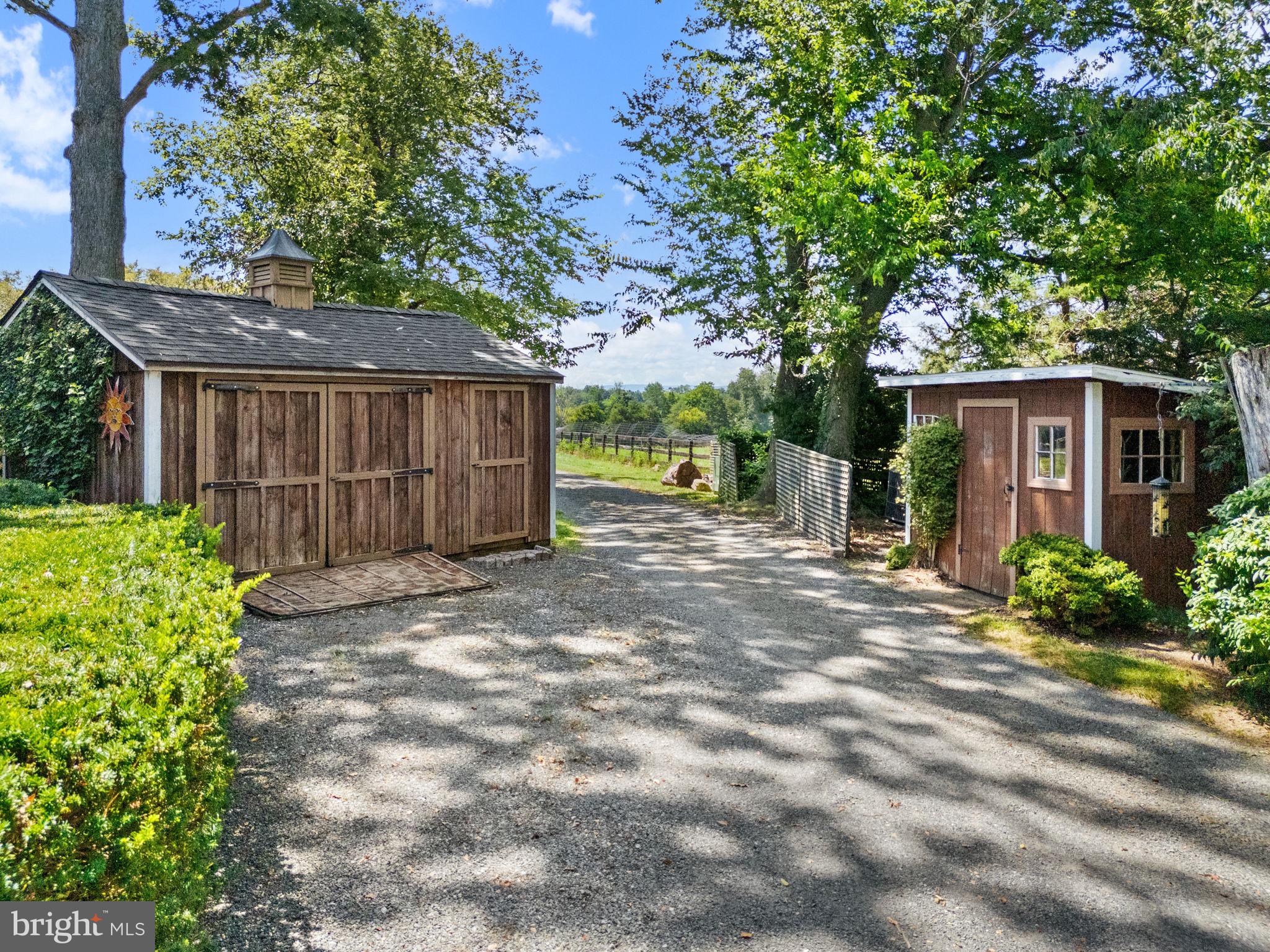 35771 Snake Hill Road Middleburg, VA 20117 - Photo 39 of 74 Driveway to barn passes two garden sheds