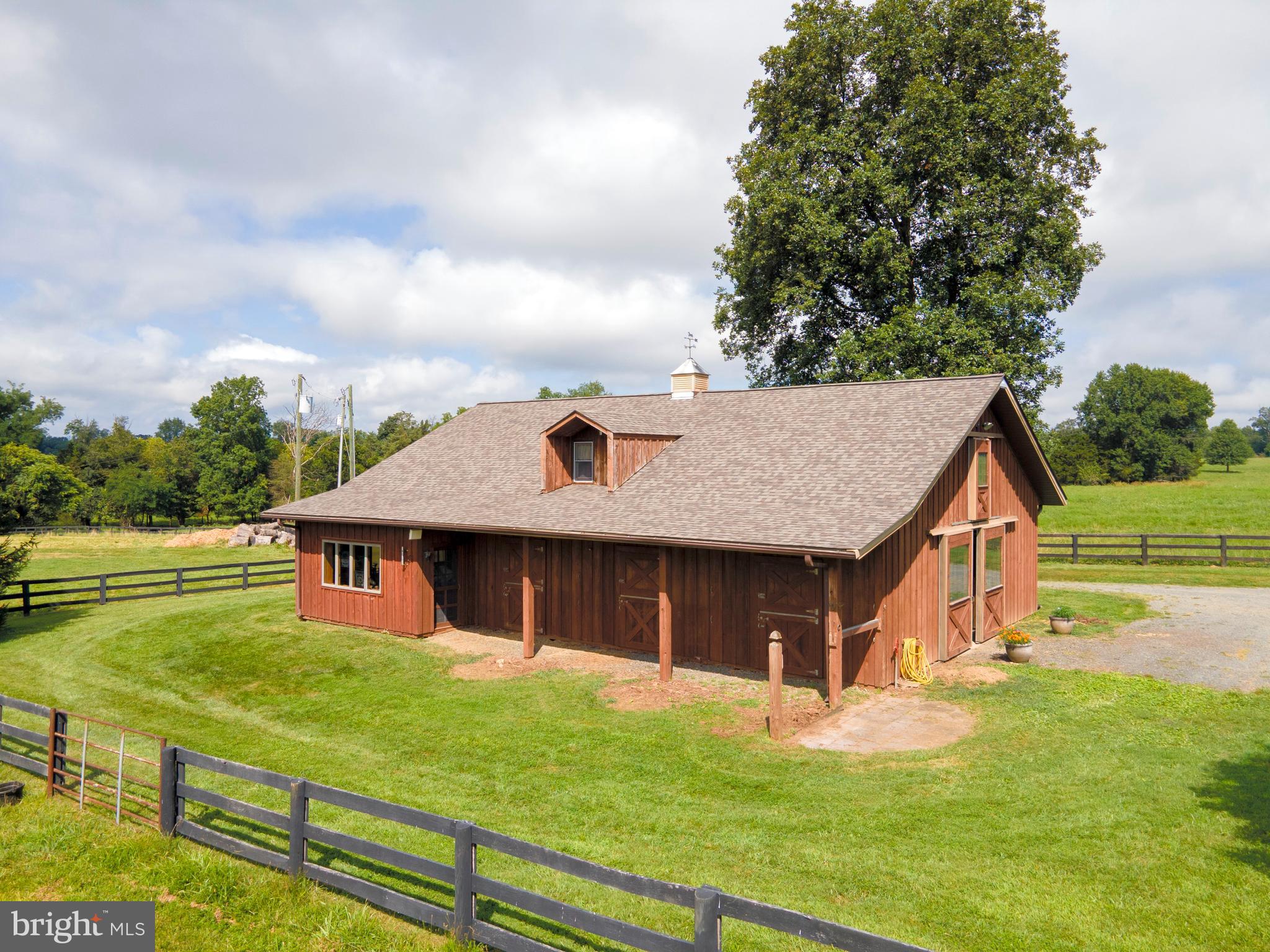 35771 Snake Hill Road Middleburg, VA 20117 - Photo 43 of 74 Barn has a side overhang & outdoor wash stall
