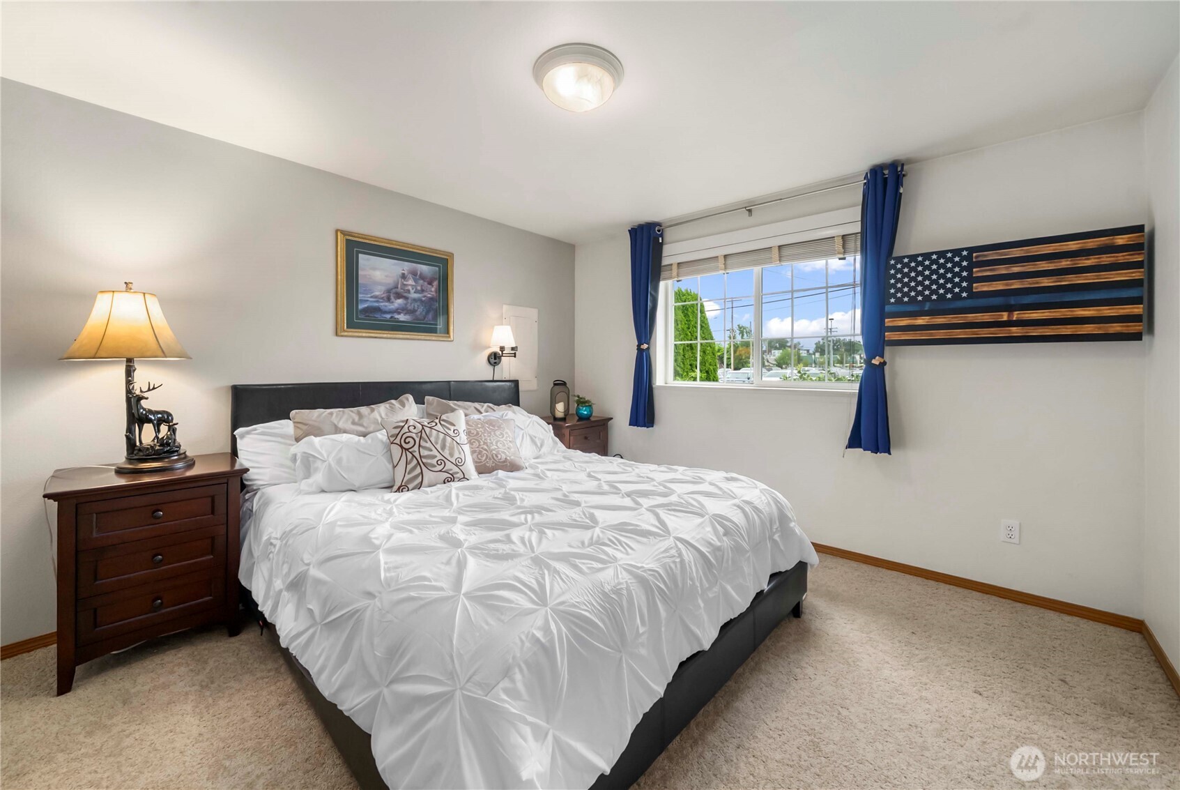 1010 Academy Street Sumner, WA 98390 - Photo 22 of 37 a bedroom with a bed and a night stand