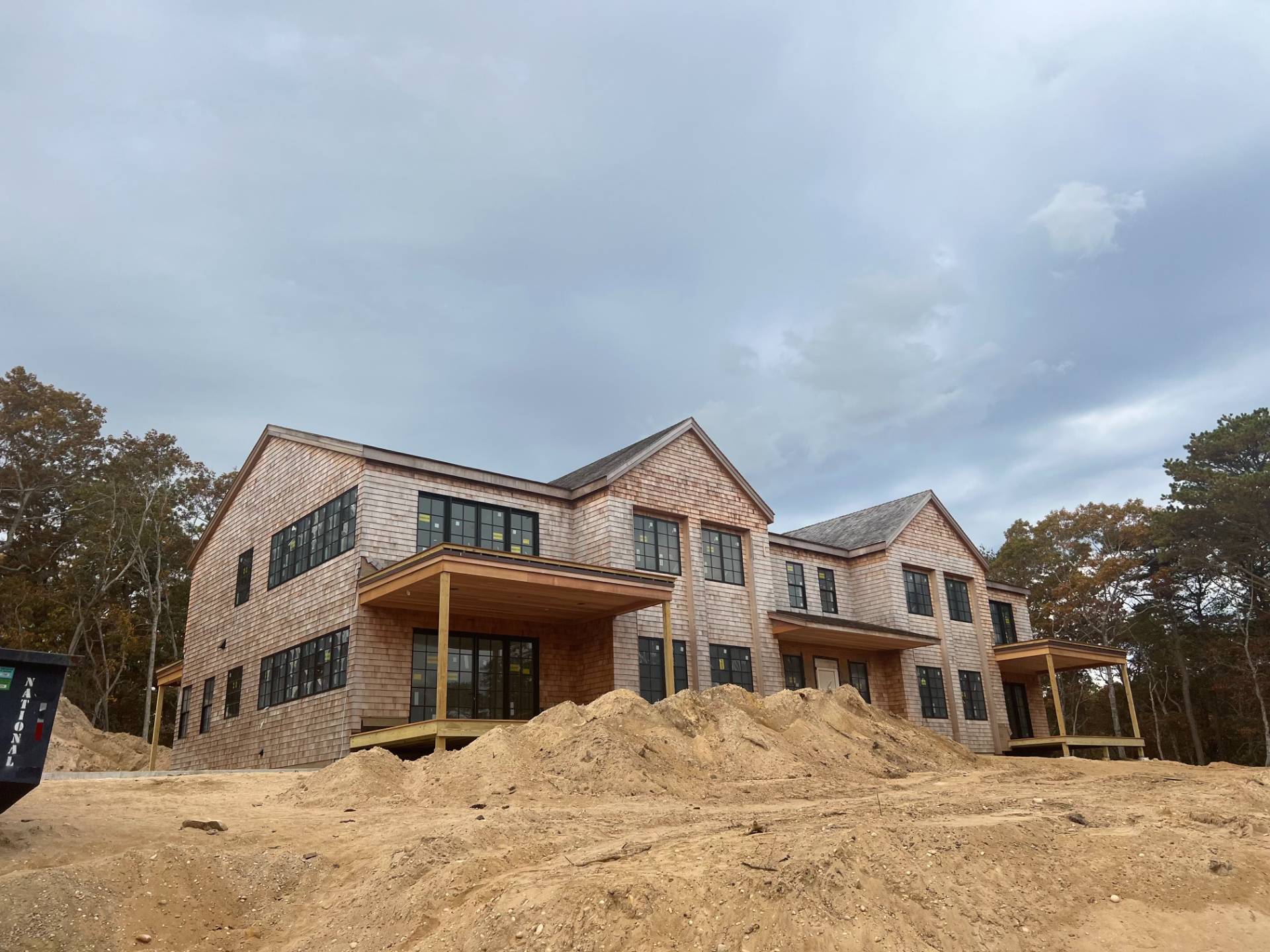 825 Old Sag Harbor Road Water Mill, NY 11976 - Photo 3 of 7 a front view of a house with a yard