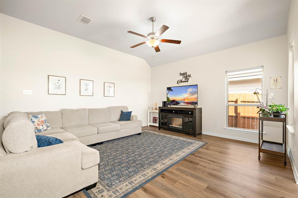 4009 Bravo Ranch Road Waco, TX 76705 - Photo 11 of 34 a living room with furniture and a flat screen tv