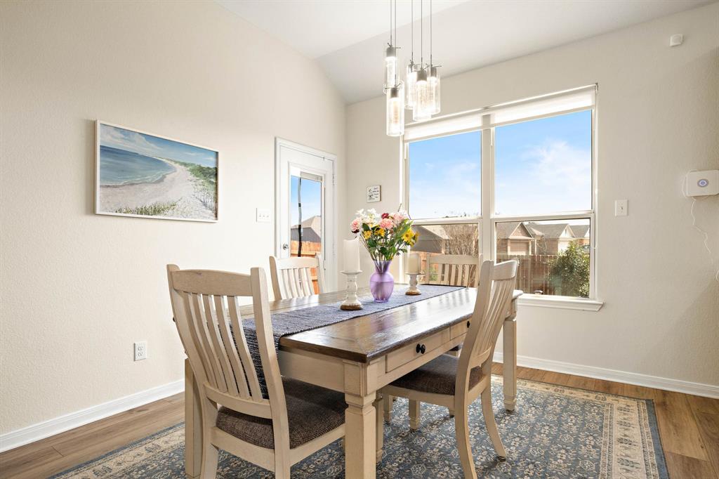 4009 Bravo Ranch Road Waco, TX 76705 - Photo 12 of 34 a view of a dining room with furniture window and wooden floor