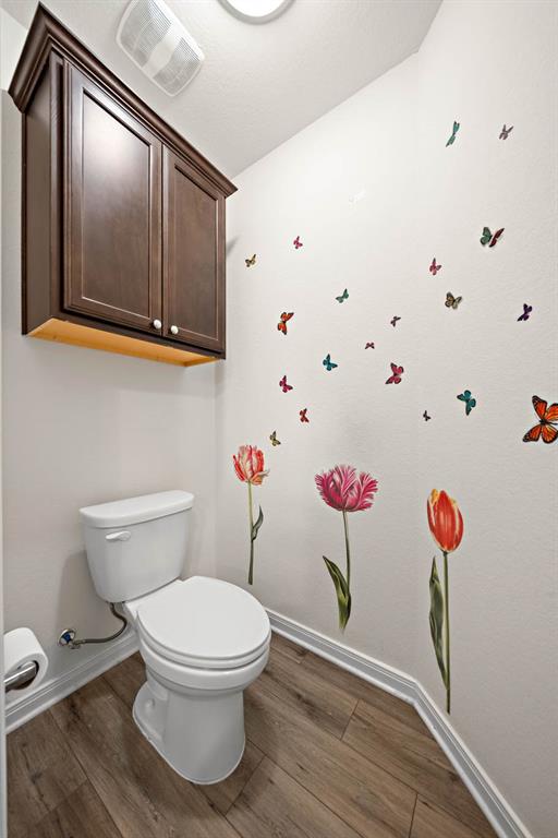 4009 Bravo Ranch Road Waco, TX 76705 - Photo 20 of 34 a bathroom with a toilet and a shower