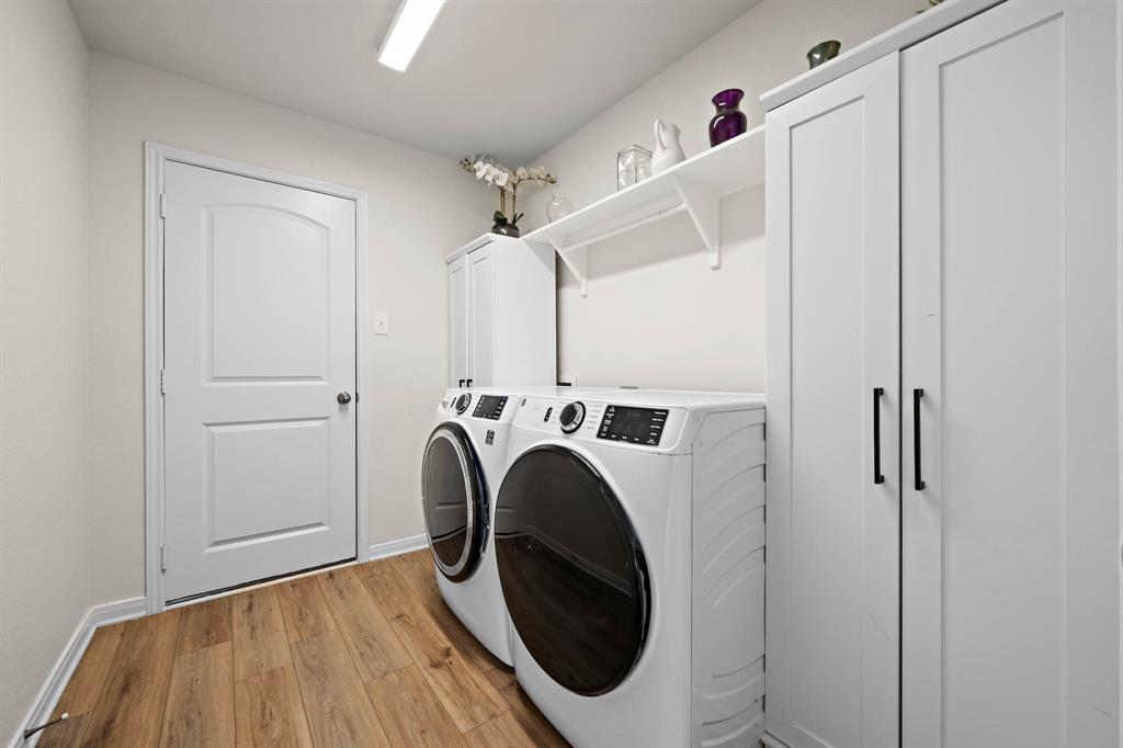 4009 Bravo Ranch Road Waco, TX 76705 - Photo 24 of 34 a utility room with dryer and washer