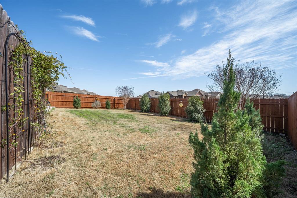 4009 Bravo Ranch Road Waco, TX 76705 - Photo 28 of 34 a backyard of a house with lots of green space