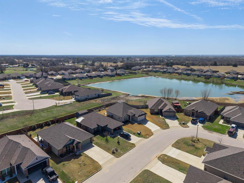 4009 Bravo Ranch Road Waco, TX 76705 - Photo 31 of 34 an aerial view of a house with outdoor space and lake view