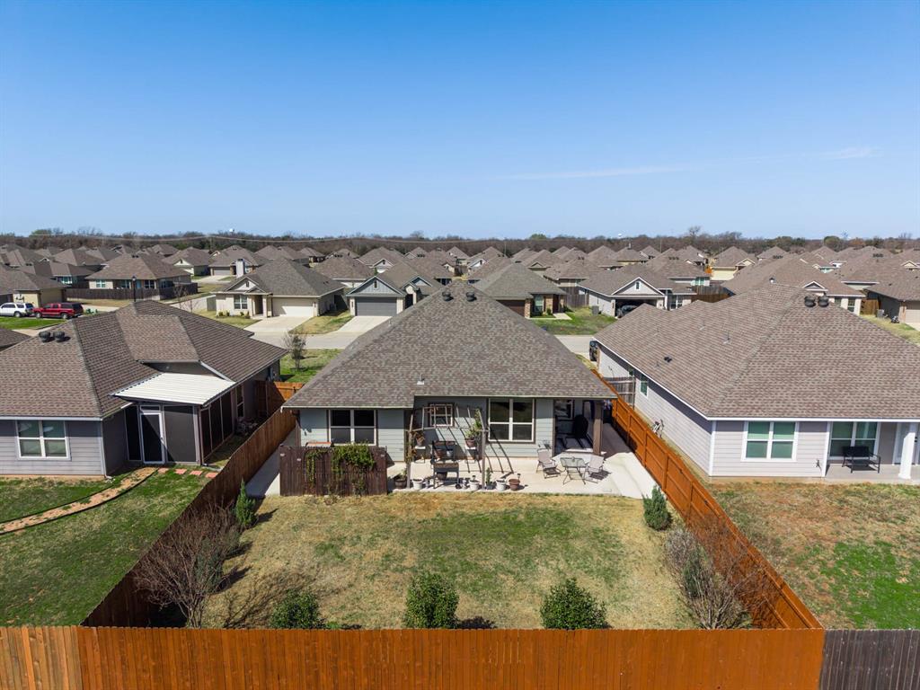 4009 Bravo Ranch Road Waco, TX 76705 - Photo 32 of 34 a aerial view of a house with a yard