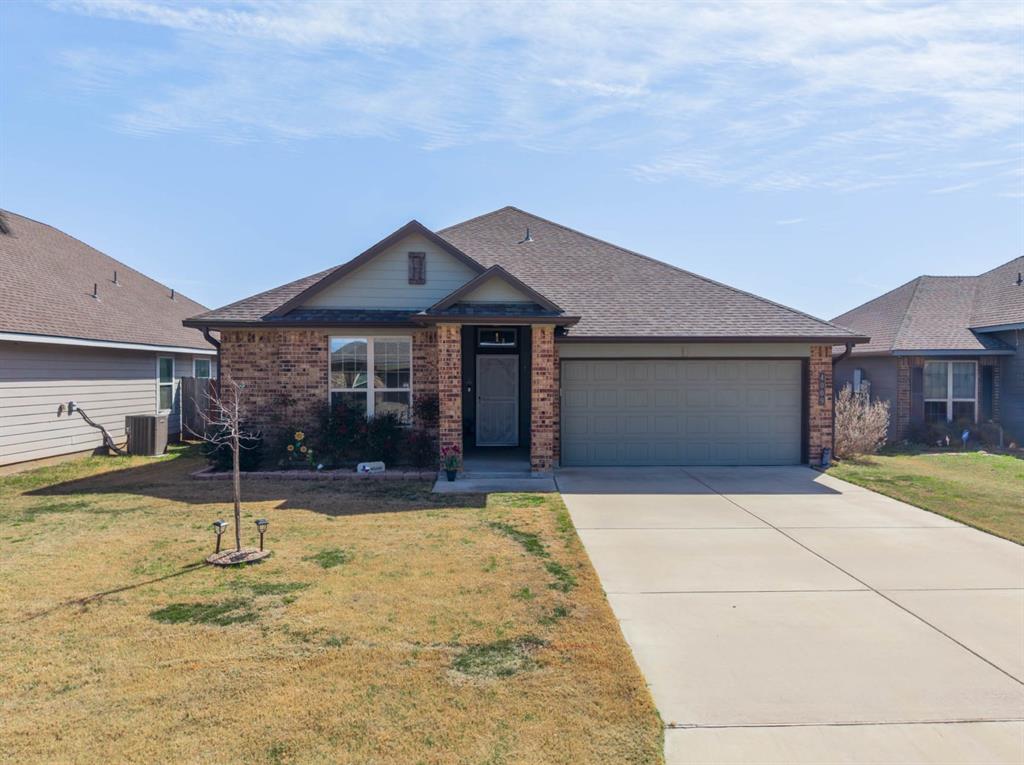 4009 Bravo Ranch Road Waco, TX 76705 - Photo 5 of 34 a front view of a house with a yard