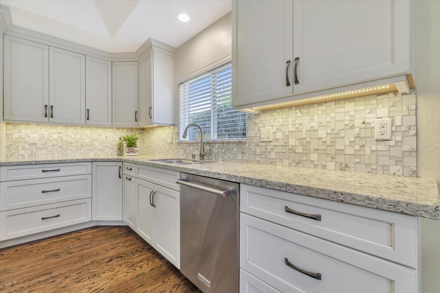 1190 Bruckner Circle Mountain View, CA 94040 - Photo 14 of 51 a kitchen with granite countertop stainless steel appliances white cabinets and a sink