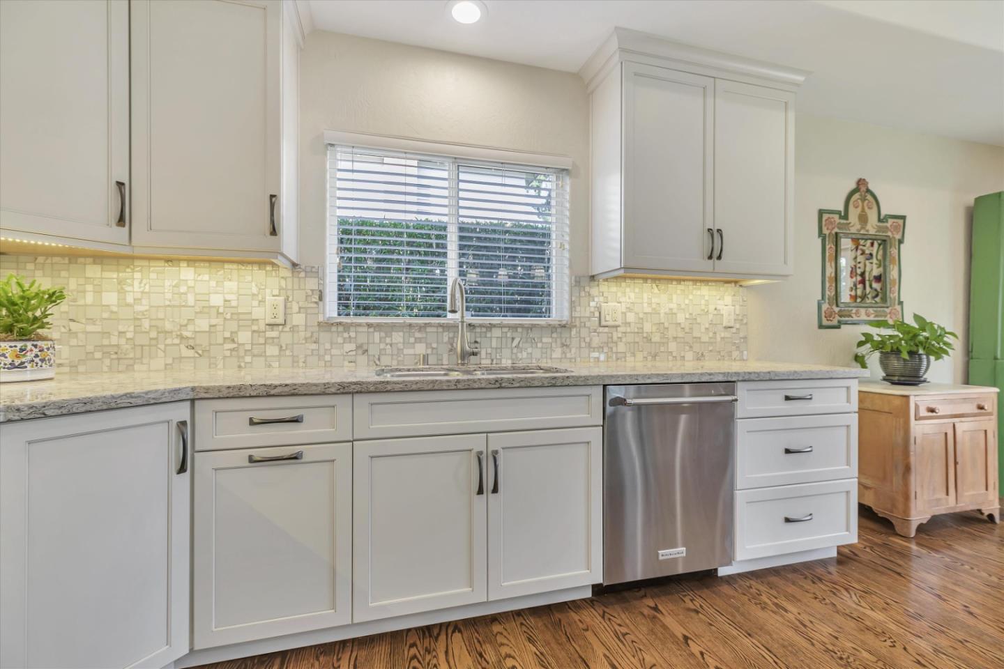 1190 Bruckner Circle Mountain View, CA 94040 - Photo 18 of 51 a kitchen with granite countertop white cabinets and white appliances