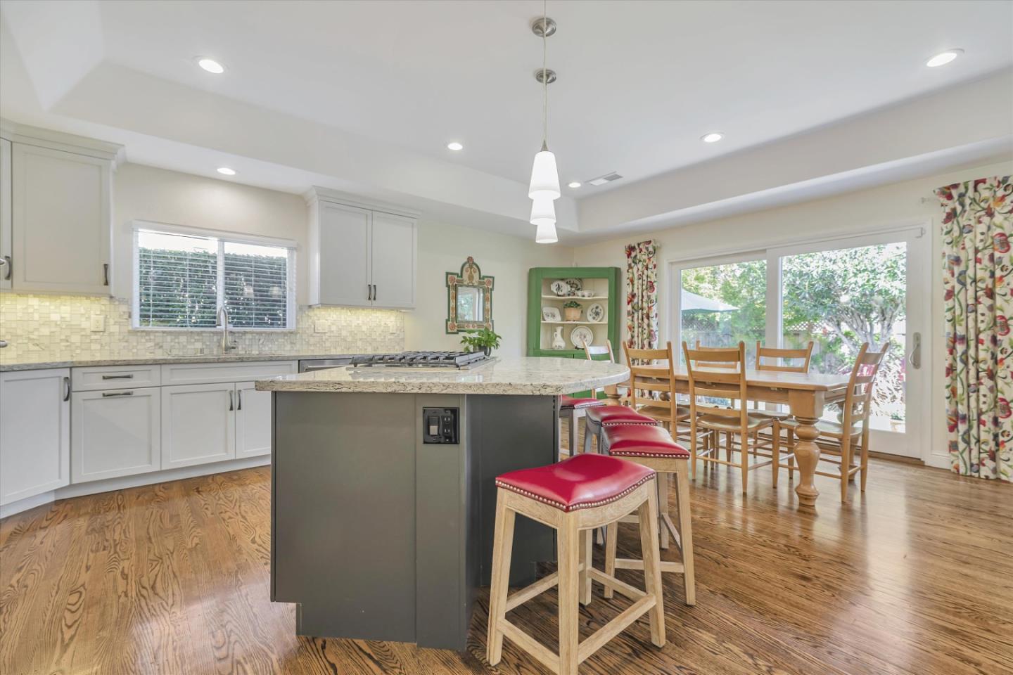 1190 Bruckner Circle Mountain View, CA 94040 - Photo 19 of 51 a kitchen with granite countertop stainless steel appliances a dining table and chairs