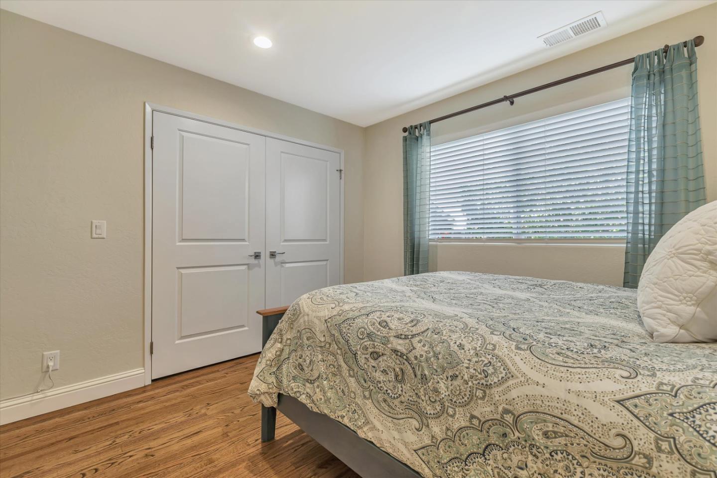 1190 Bruckner Circle Mountain View, CA 94040 - Photo 21 of 51 a bedroom with a bed and a window