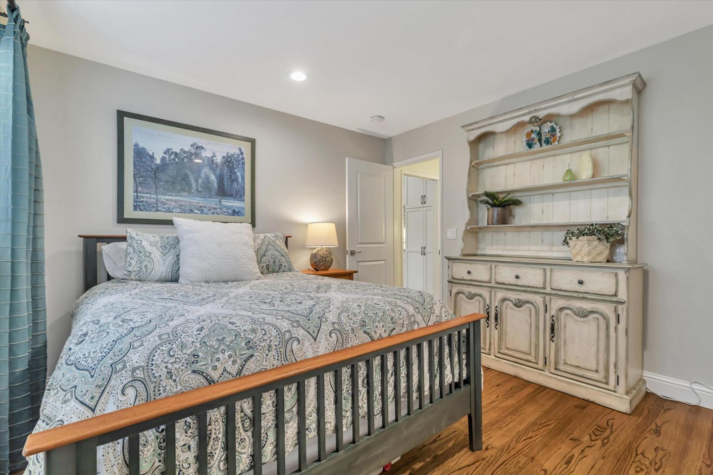 1190 Bruckner Circle Mountain View, CA 94040 - Photo 23 of 51 a bedroom with a bed and wooden floor