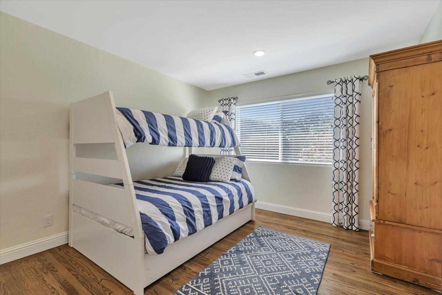 1190 Bruckner Circle Mountain View, CA 94040 - Photo 31 of 51 a bedroom with a bed and wooden floor