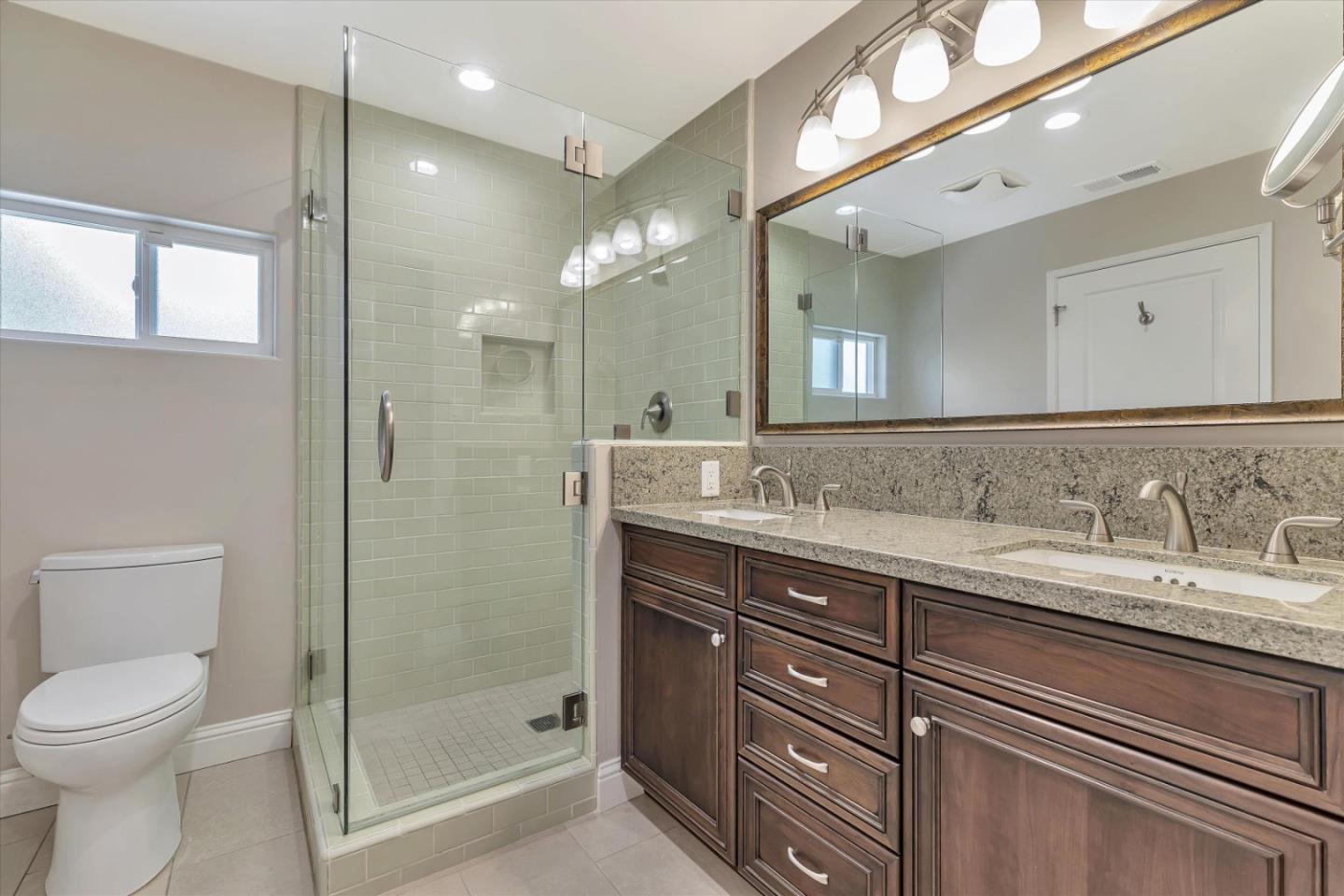 1190 Bruckner Circle Mountain View, CA 94040 - Photo 39 of 51 a bathroom with a granite countertop sink a toilet and a shower