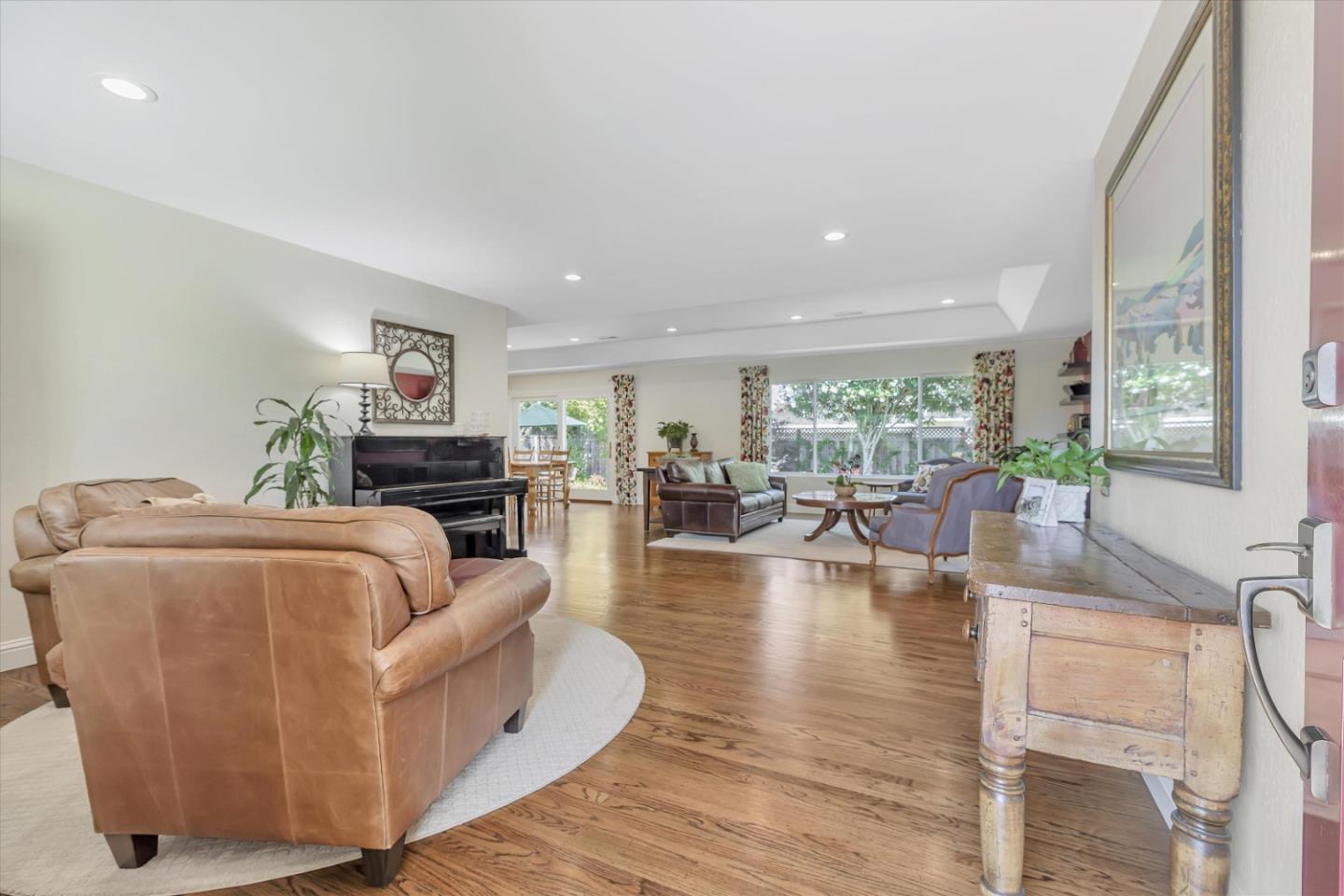 1190 Bruckner Circle Mountain View, CA 94040 - Photo 4 of 51 a living room with fireplace furniture and a large window