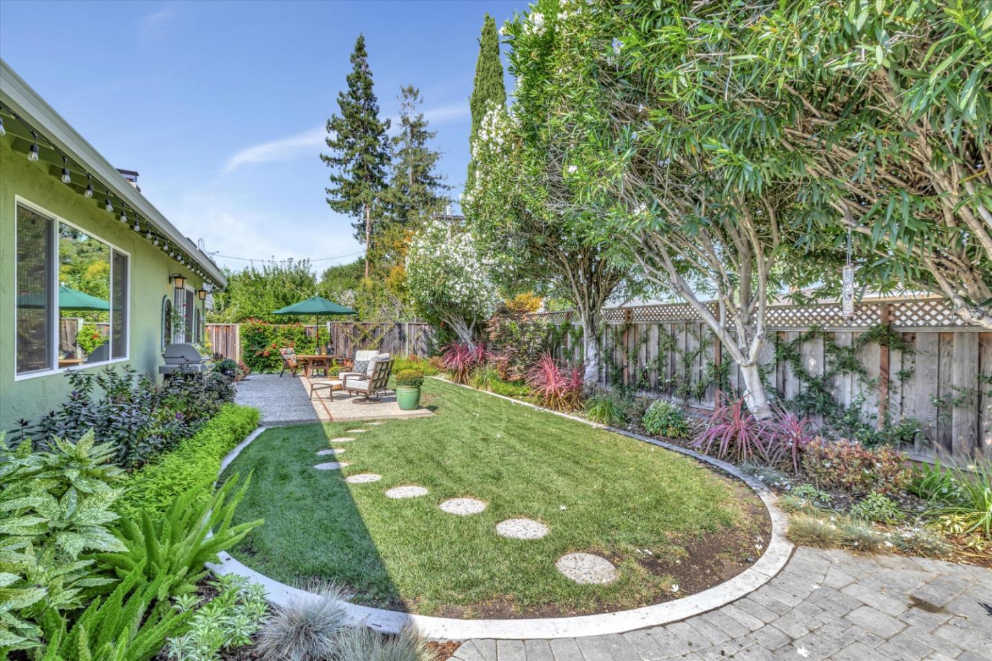 1190 Bruckner Circle Mountain View, CA 94040 - Photo 48 of 51 a view of a backyard with potted plants and large trees
