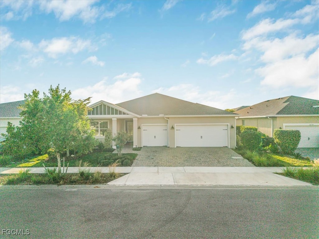16128 Lotus Way Punta Gorda, FL 33982 - Photo 1 of 49 a front view of a house with a yard and garage