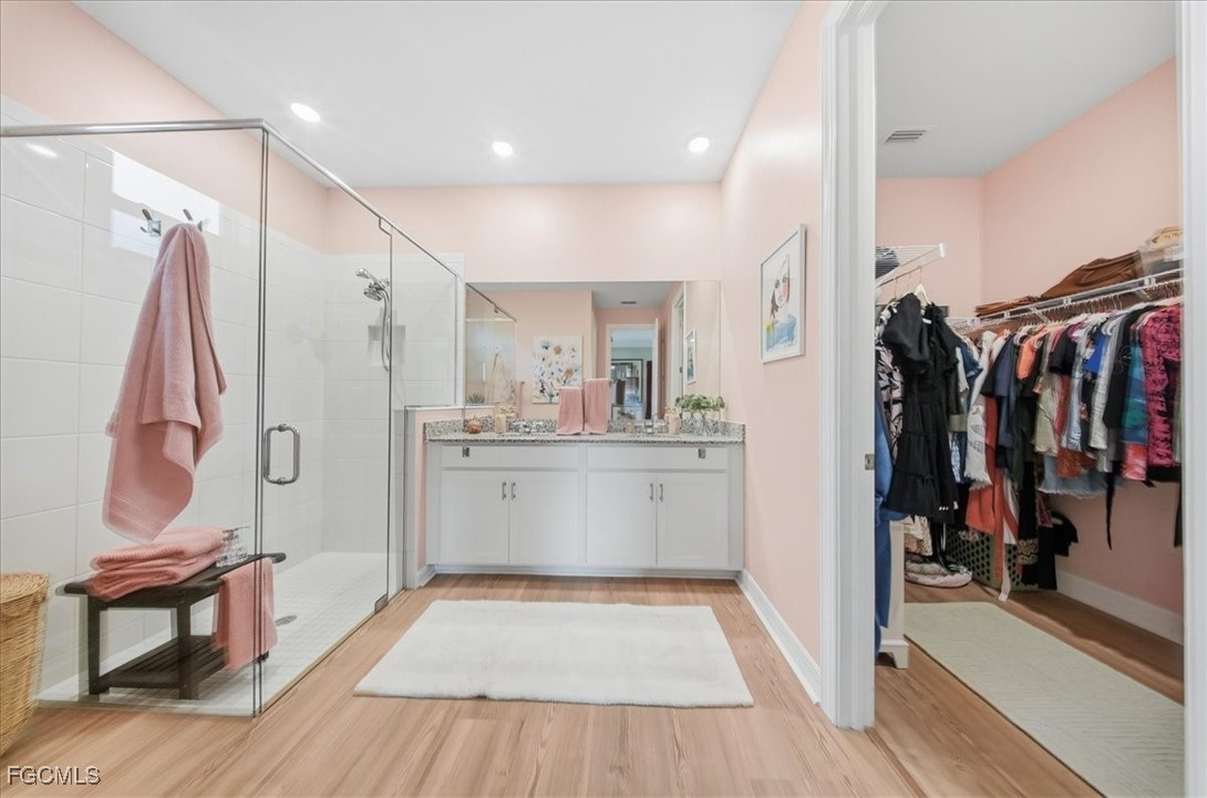 16128 Lotus Way Punta Gorda, FL 33982 - Photo 16 of 49 a view of walk in closet with clothes and shoes