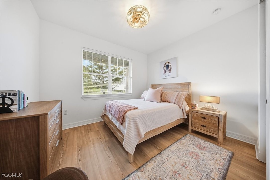 16128 Lotus Way Punta Gorda, FL 33982 - Photo 20 of 49 a bedroom with a bed and a window