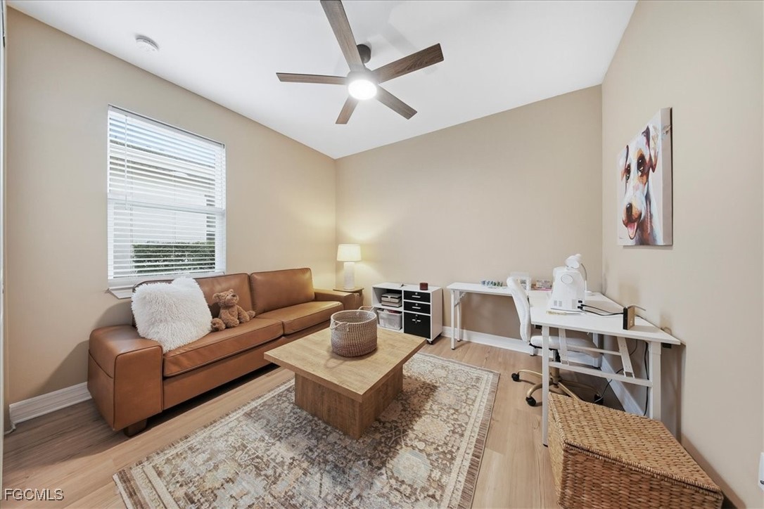 16128 Lotus Way Punta Gorda, FL 33982 - Photo 26 of 49 a living room with furniture and a large window