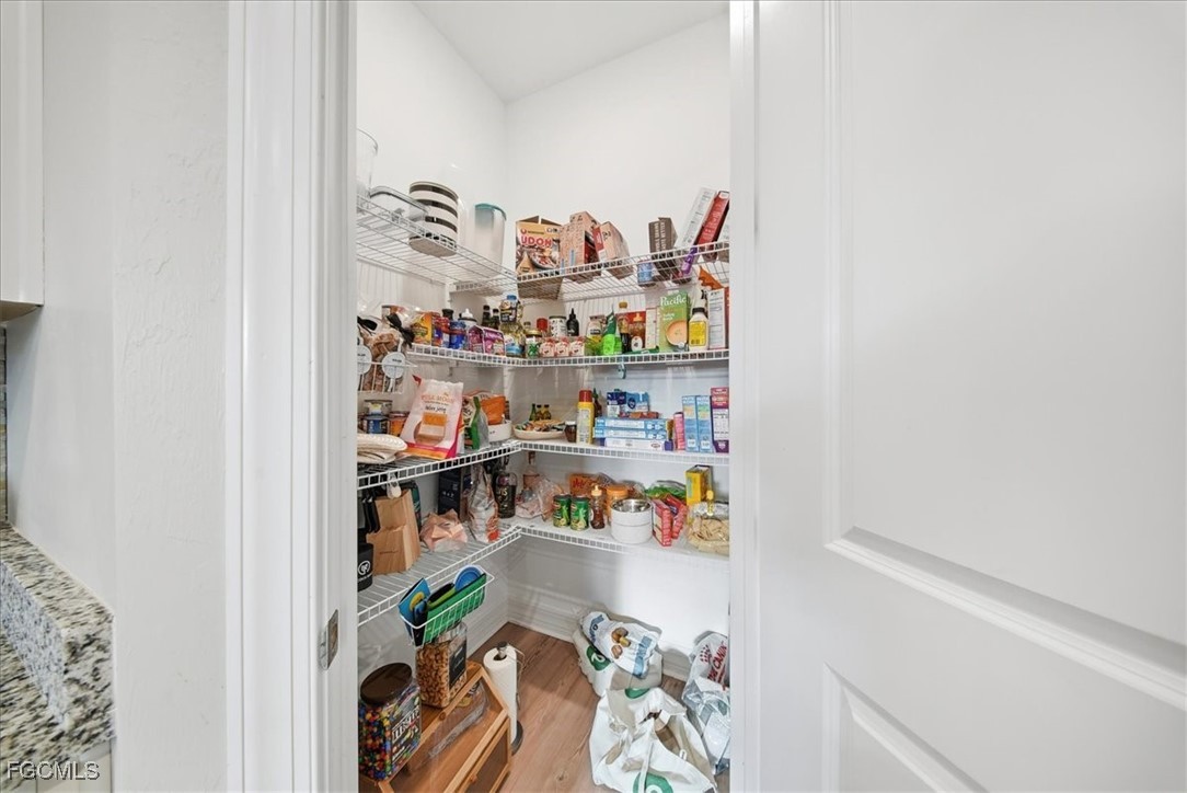 16128 Lotus Way Punta Gorda, FL 33982 - Photo 42 of 49 a shelf with books and knick knacks on it