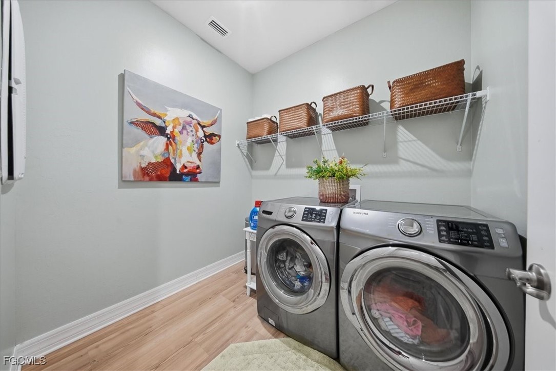 16128 Lotus Way Punta Gorda, FL 33982 - Photo 45 of 49 a view of storage and utility room with washer and dryer