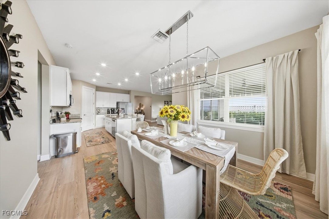 16128 Lotus Way Punta Gorda, FL 33982 - Photo 6 of 49 a very nice looking dining room with a table and chairs