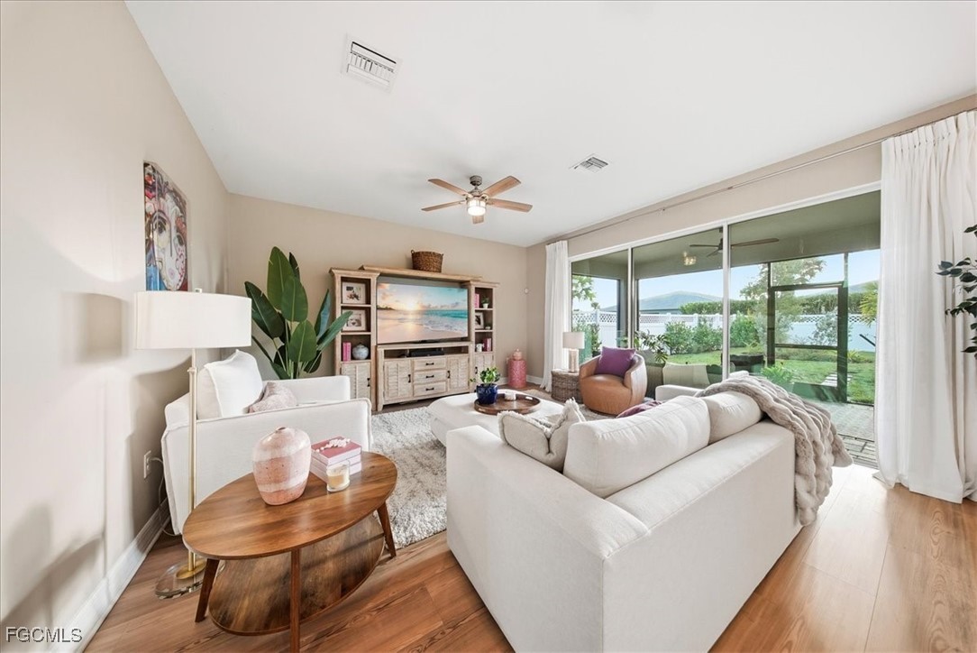 16128 Lotus Way Punta Gorda, FL 33982 - Photo 7 of 49 a living room with furniture and a large window