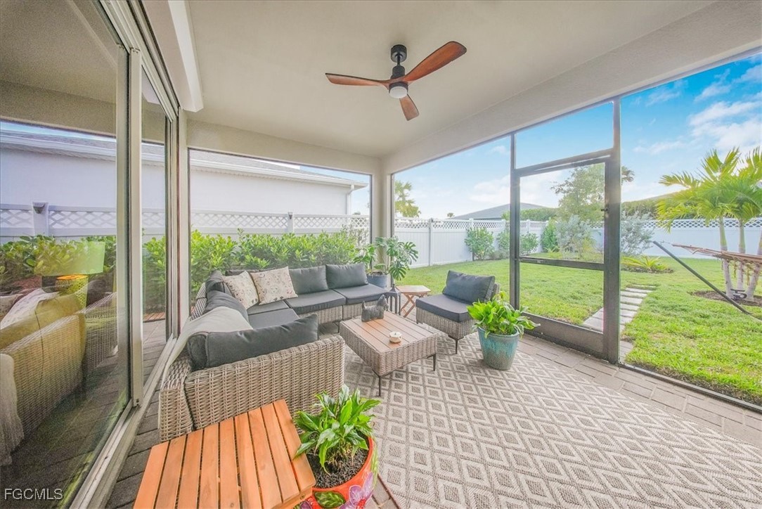 16128 Lotus Way Punta Gorda, FL 33982 - Photo 9 of 49 a living room with patio furniture and garden view