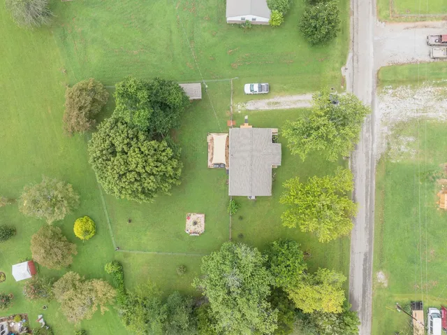 view of a garden with a house