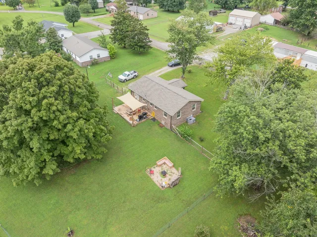 a bird view of a house with a yard