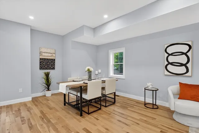 a workspace with furniture wooden floor and window