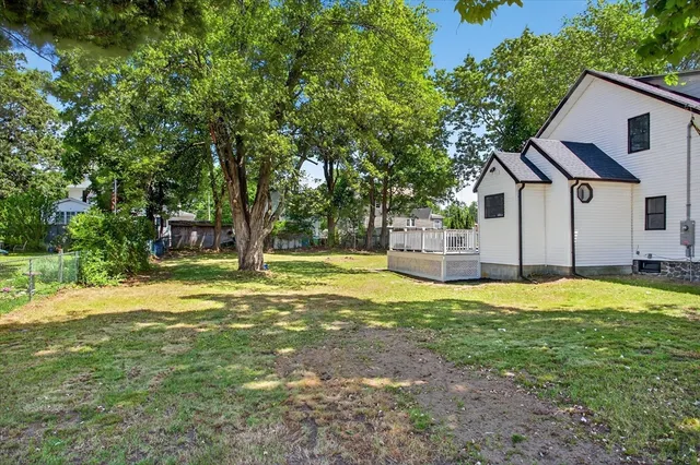 a house with swimming pool in front of it