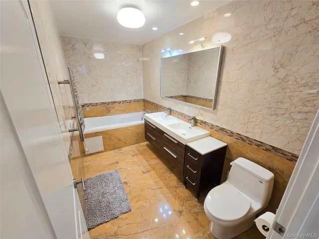 a bathroom with a bathtub and shower