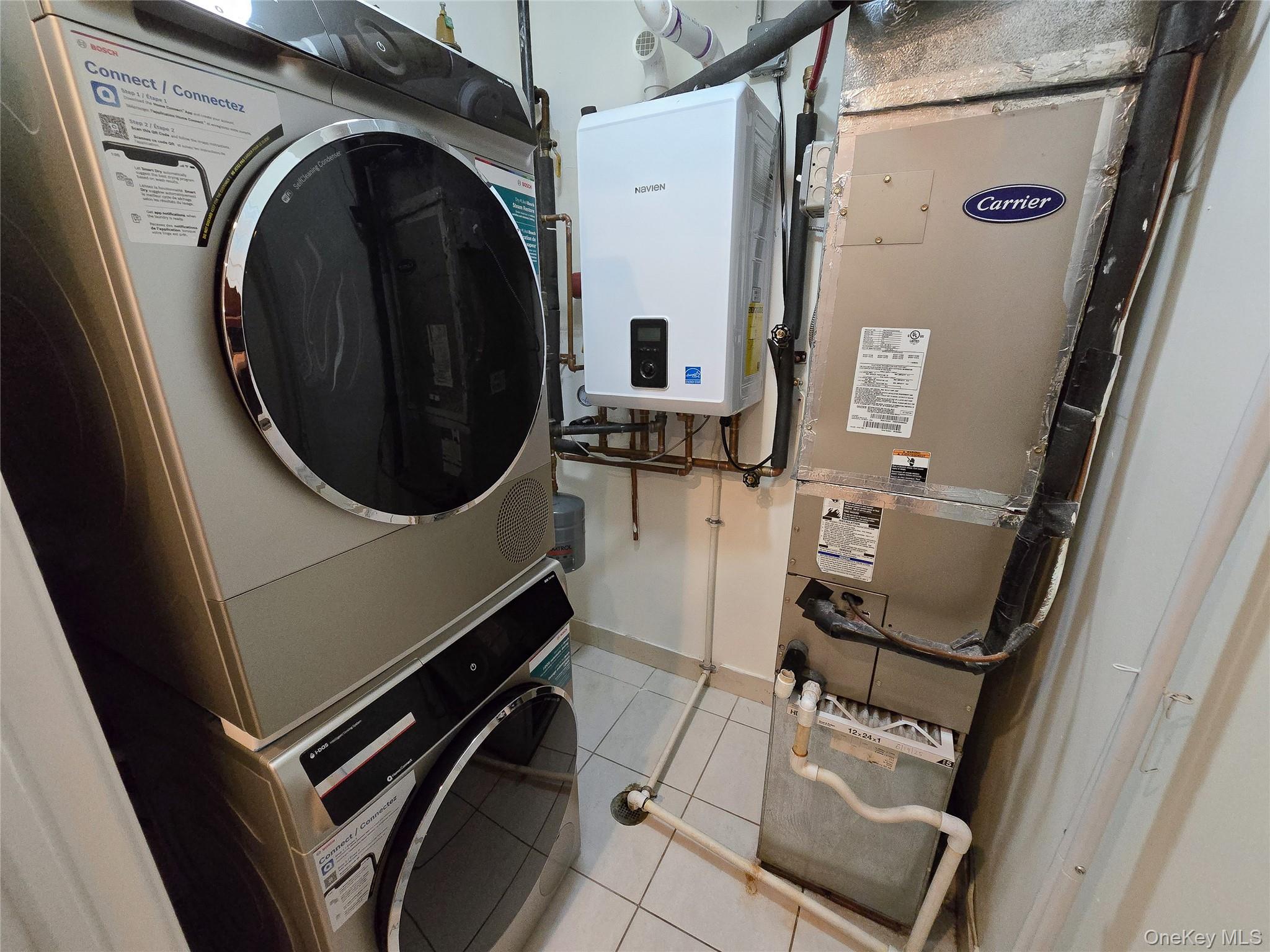 63-36 99th Street, Unit 5B Queens, NY 11374 - Photo 9 of 20 a close up view of a washer and dryer