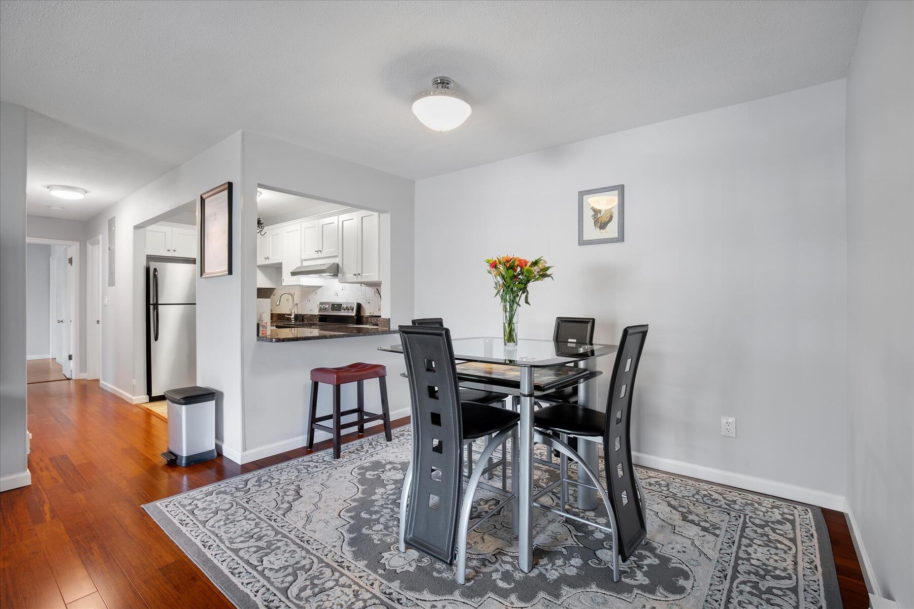 800 Bearses Way, Unit 1EB Hyannis, MA 02601 - Photo 11 of 37 a view of a dining room with furniture