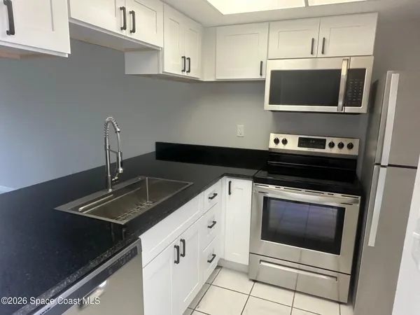 a kitchen with a stove and a microwave